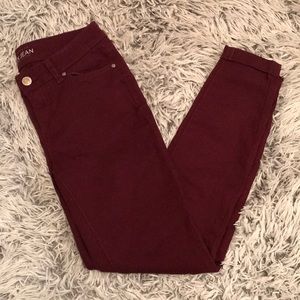 Stretchy burgundy skinny jeans